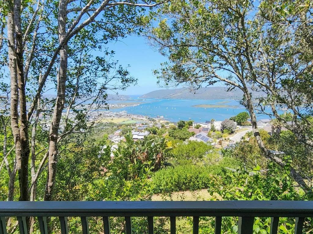 Panoramic view of Knysna Heads and turquoise lagoon from elevated deck