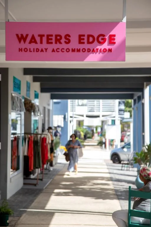 Waters Edge Holiday Accommodation storefront sign and entrance area