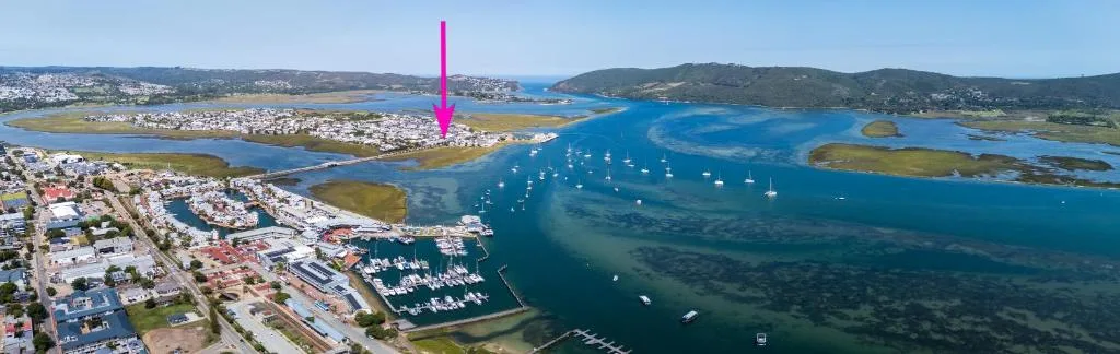 Aerial view of Knysna Heads lagoon with sailboats and coastal town
