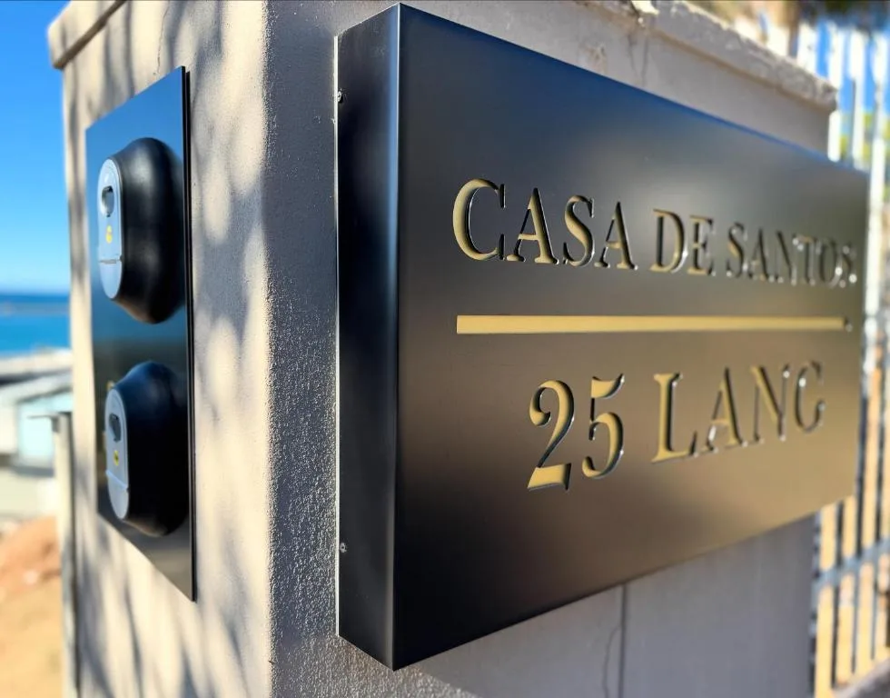 Casa de Santos property name plaque with address number displayed