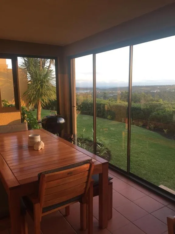 Expansive landscape vista from dining area with rolling hills and valleys