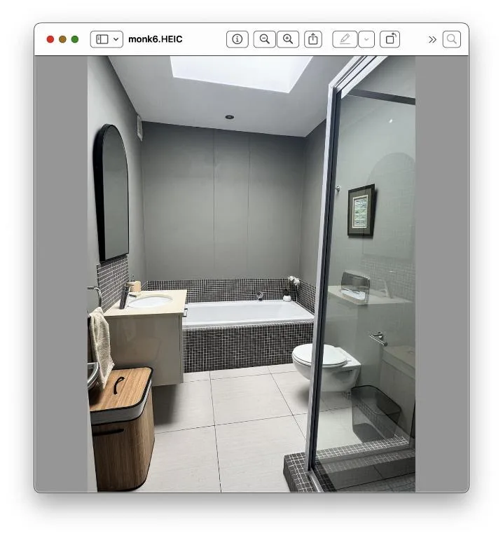 Modern bathroom with bathtub, walk-in shower, and sleek vanity setup