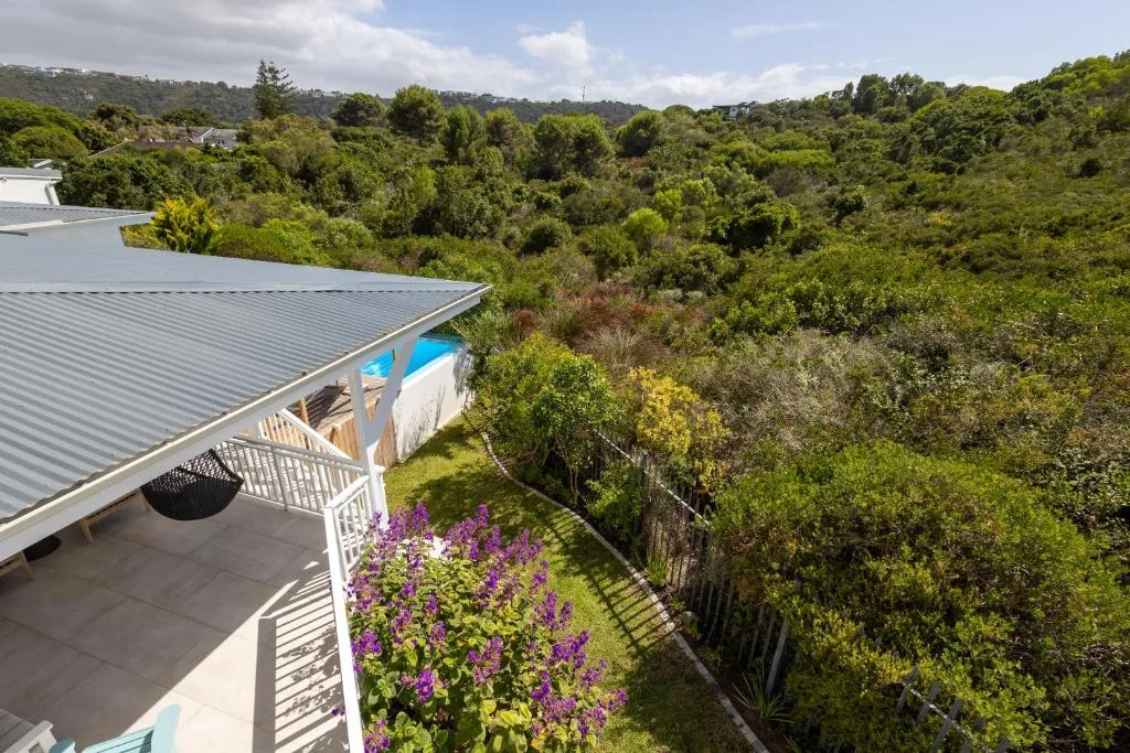 Lush forested valley landscape vista from elevated property deck