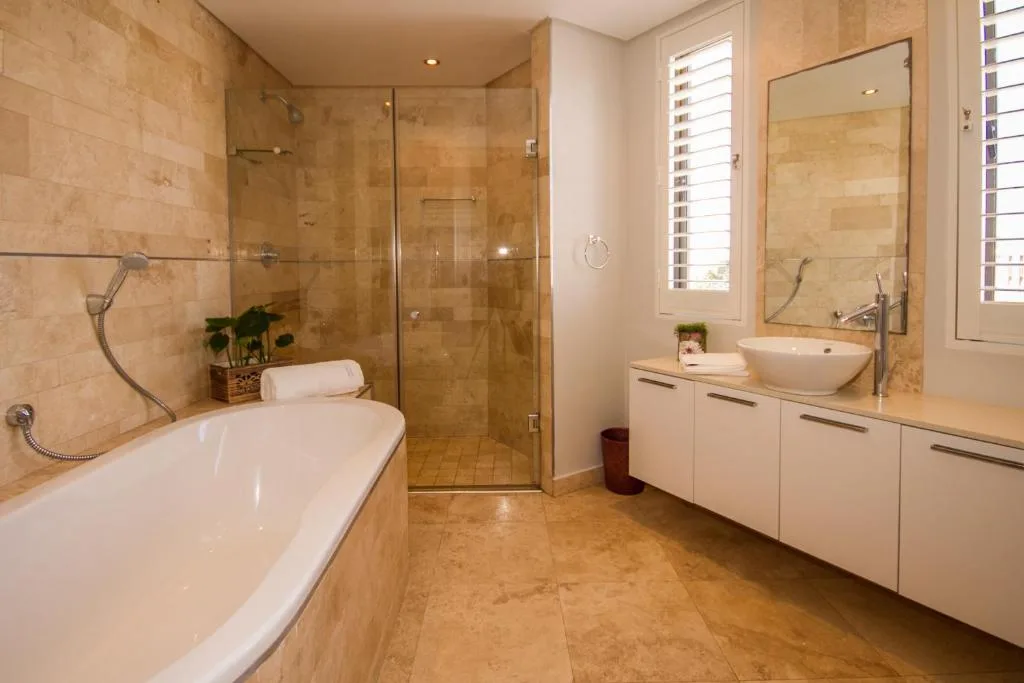Spacious bathroom with freestanding tub, walk-in shower, and double vanity
