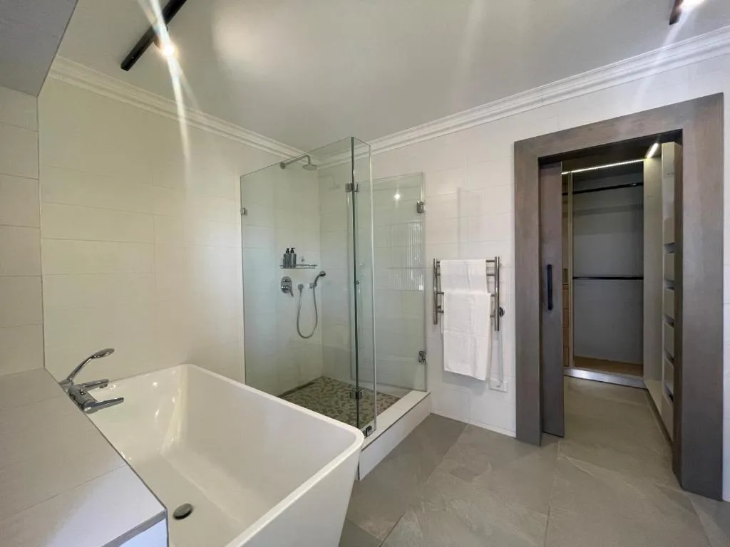 Modern bathroom with freestanding tub and spacious glass-enclosed shower