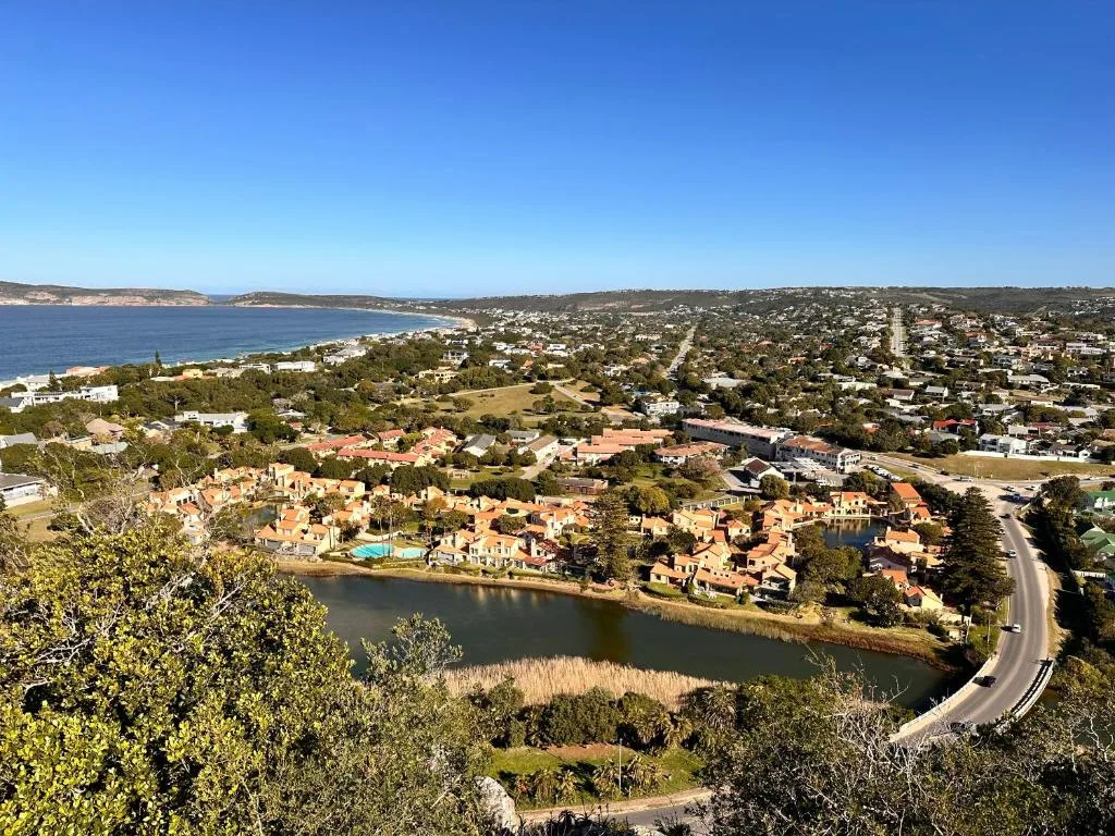 Aerial view of Plettenberg Bay coastal town with lagoon and ocean