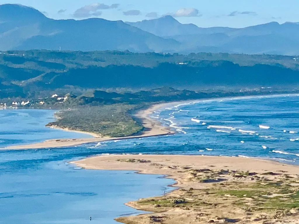 Panoramic coastal view of Plettenberg Bay with mountains and sandy beaches