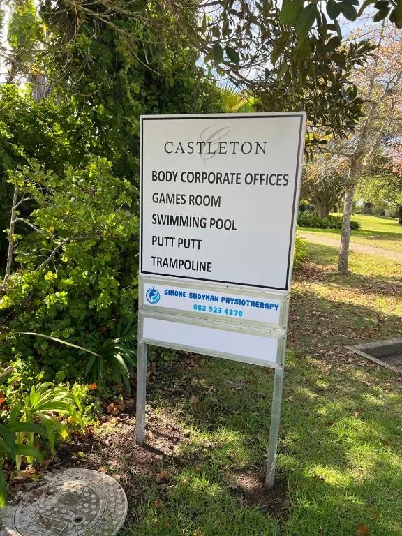 Castleton property signage listing amenities including pool, games room, trampoline