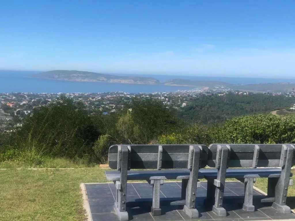 Coastal landscape with bay, islands, and forested hills from elevated viewpoint