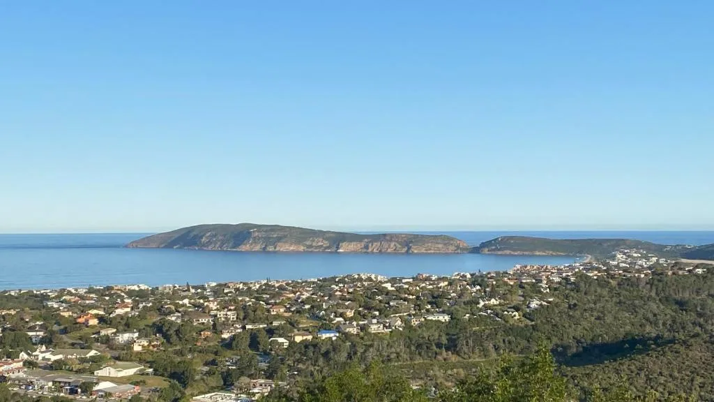Coastal vista of Plettenberg Bay with islands and forested hillsides