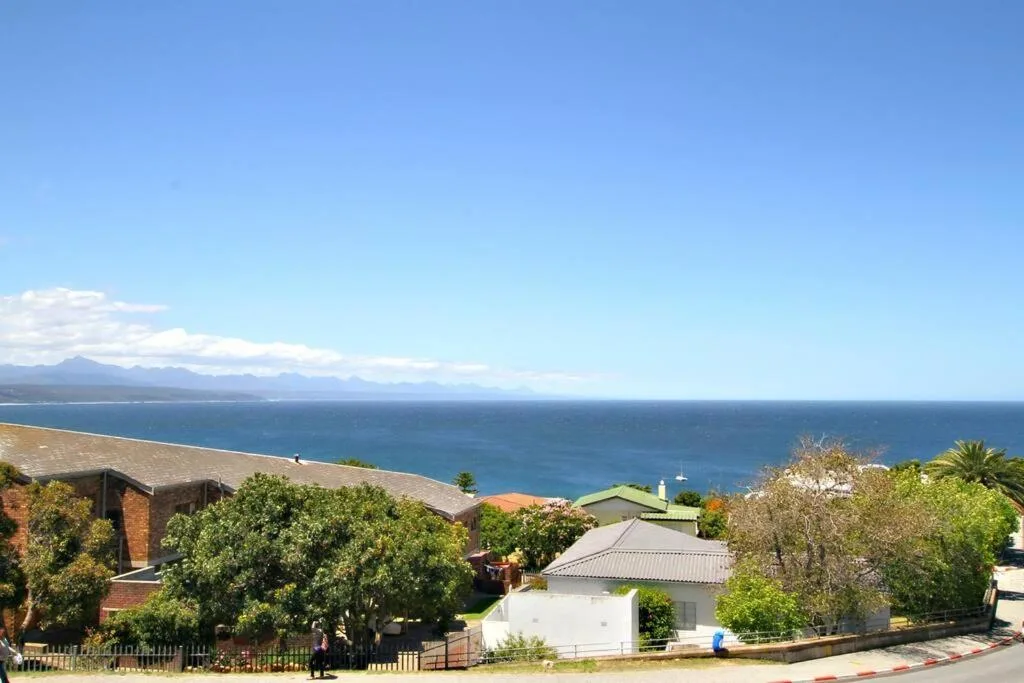Ocean and mountain vista from elevated property overlooking Plettenberg Bay coastline