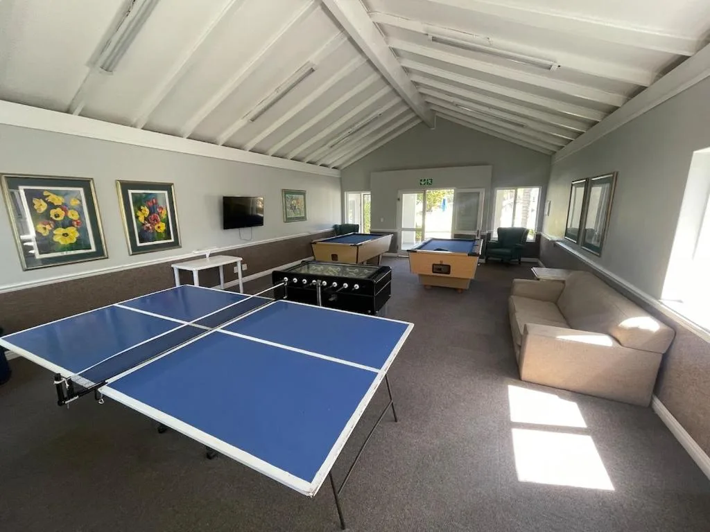 Recreation room with ping pong, foosball, and pool tables