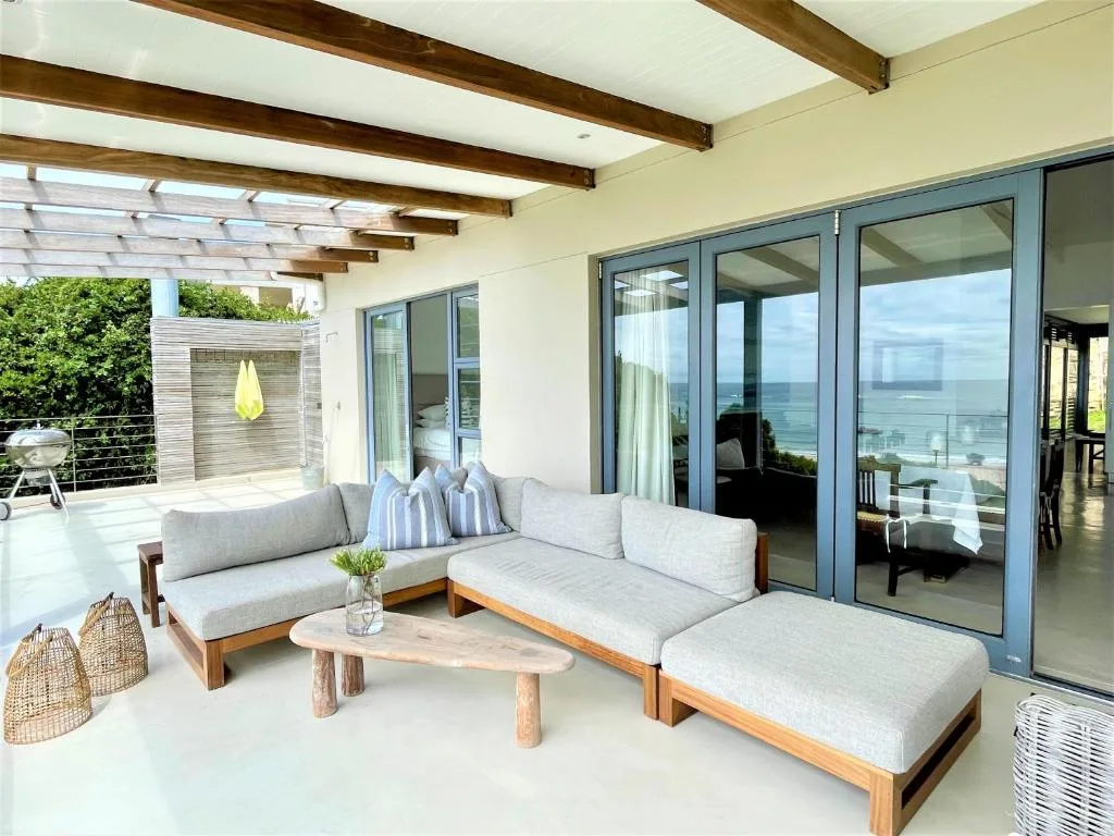 Modern outdoor deck with contemporary seating and ocean views