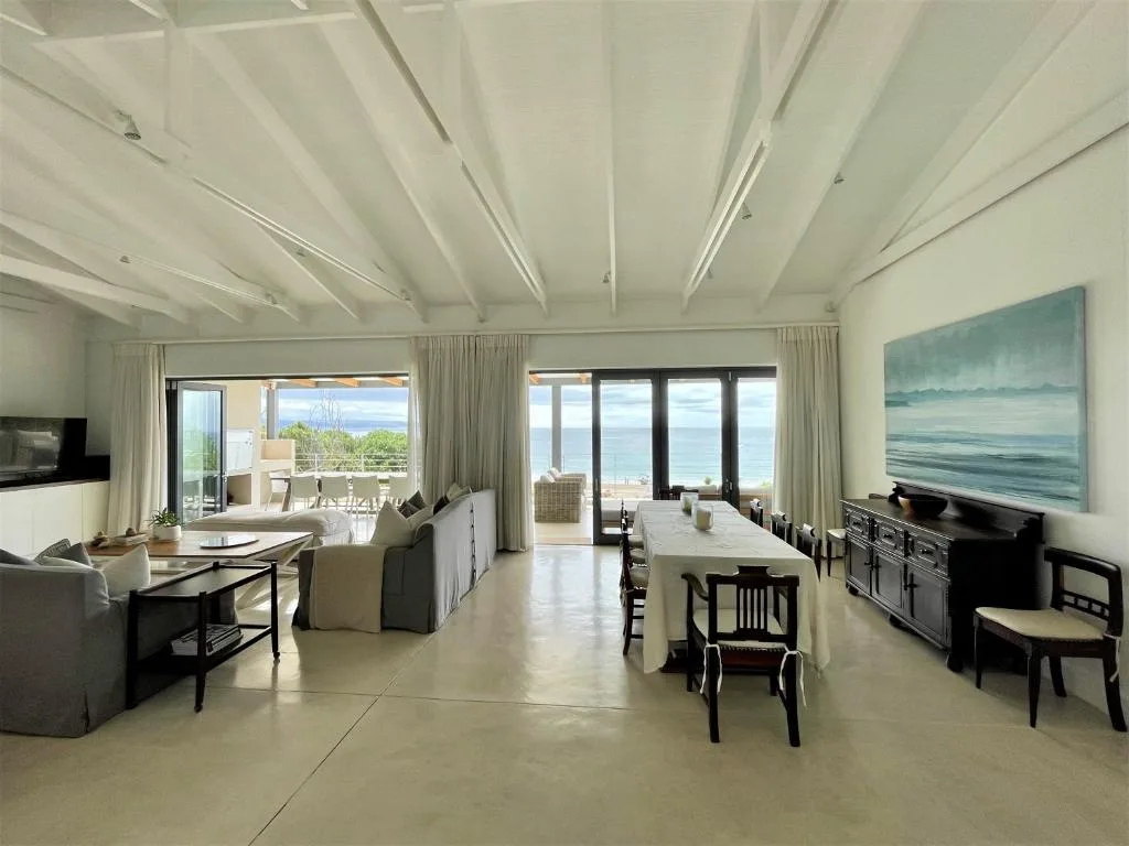 Spacious open-plan living room with ocean views and modern furnishings