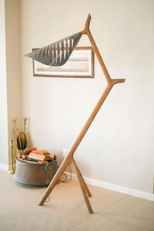 Wooden fish sculpture and decorative basket in modern interior