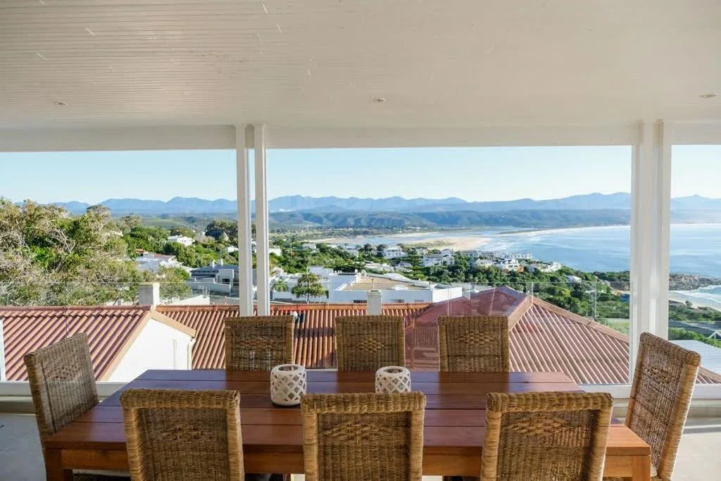 Panoramic coastal views of Plettenberg Bay and mountains from dining area