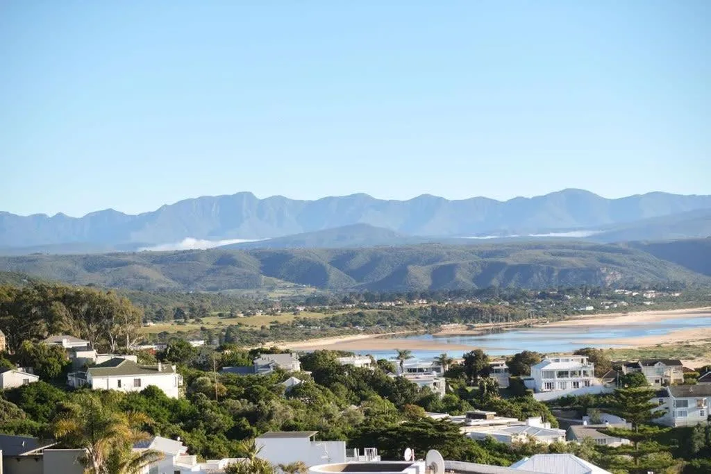 Mountain and lagoon vista from hilltop villa overlooking Plettenberg Bay coastline