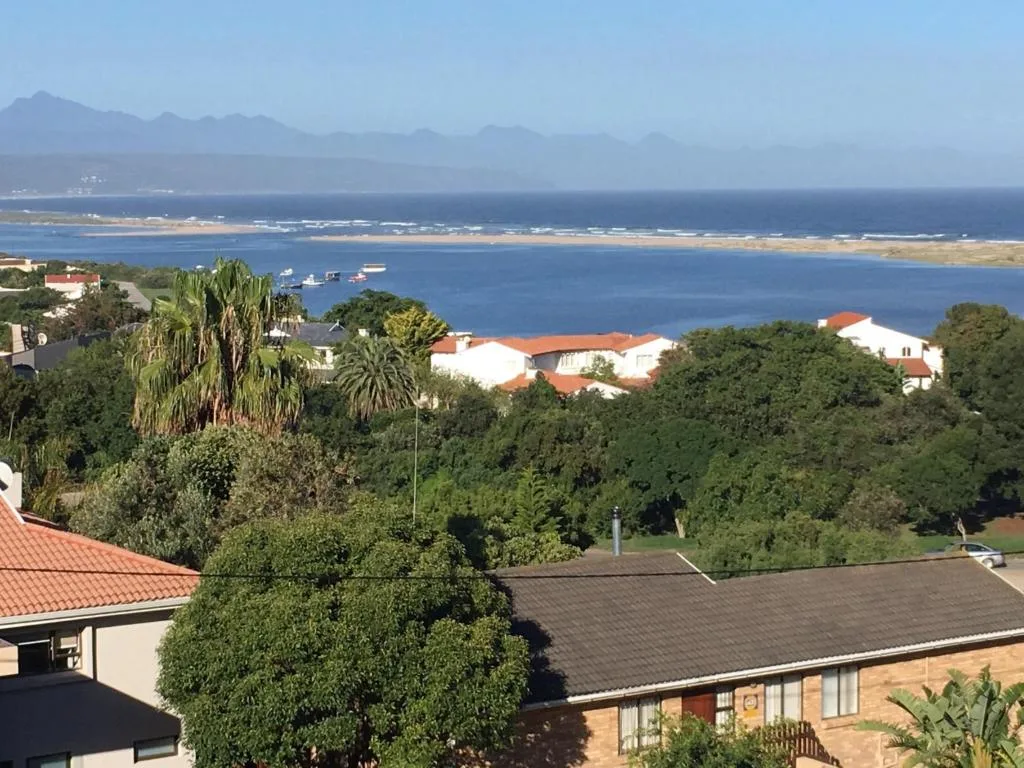 Scenic coastal view of Plettenberg Bay with mountains and lagoon beyond