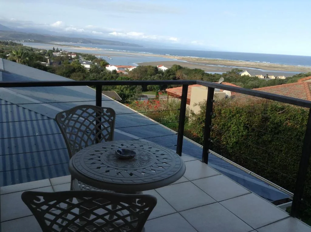 Coastal lagoon and ocean view from elevated deck with seating