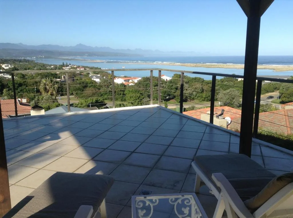 Lagoon and coastal mountain views from elevated deck with seating
