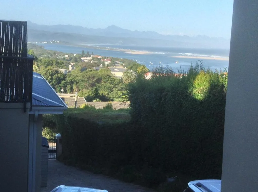 Scenic coastal vista of Plettenberg Bay lagoon and mountains from property