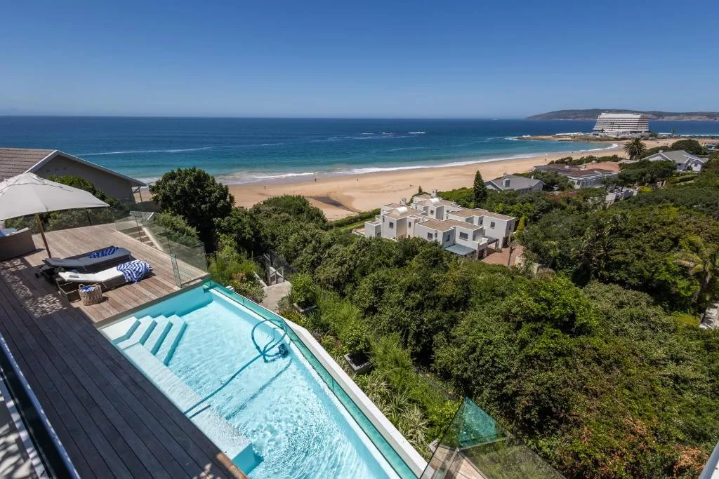 Stunning ocean and beach views from elevated property with pool