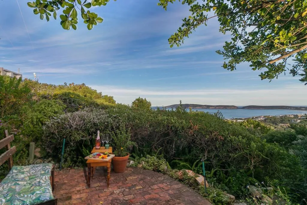 Scenic lagoon and coastal landscape view from garden terrace with vegetation