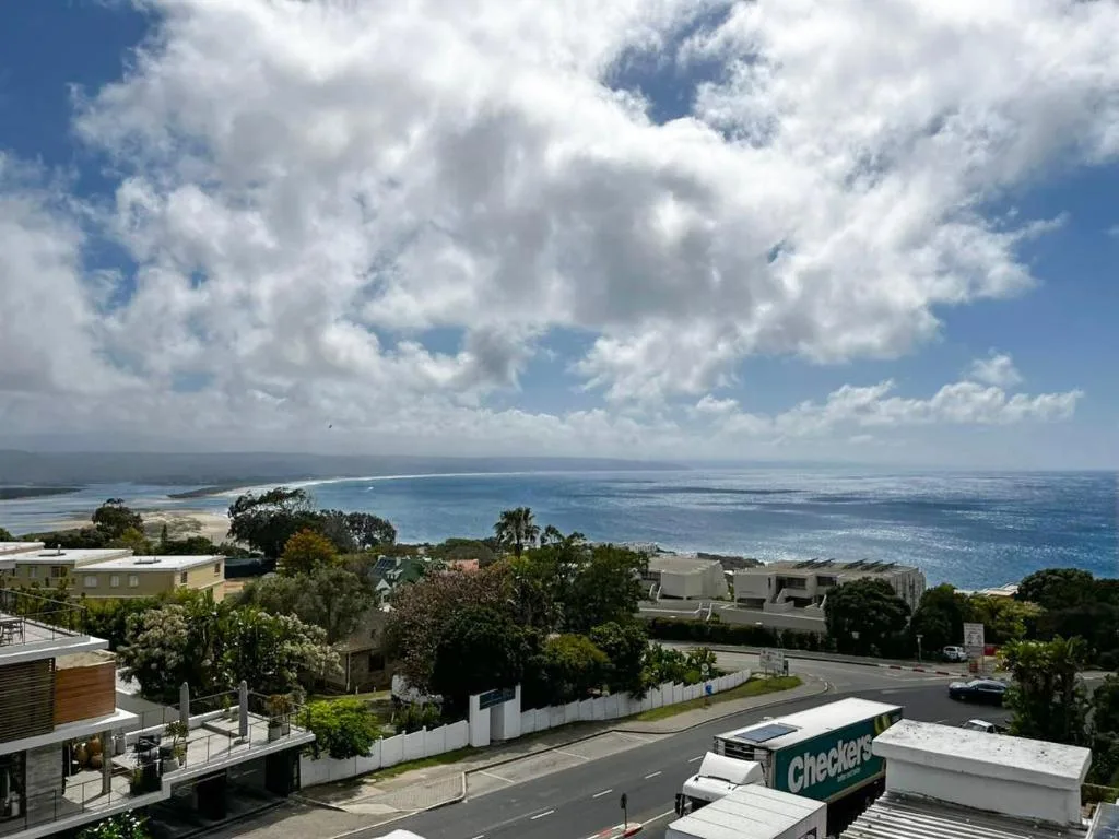 Panoramic coastal view of Plettenberg Bay with blue ocean and white sandy beaches