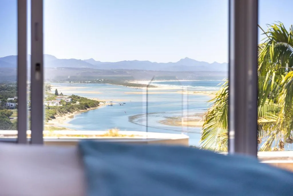 Stunning lagoon and mountain vista framed through interior windows
