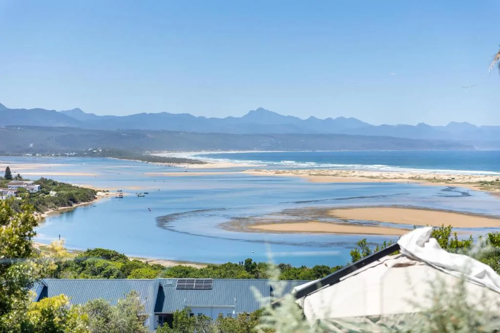 Panoramic lagoon and mountain vista from elevated property overlooking Plettenberg Bay
