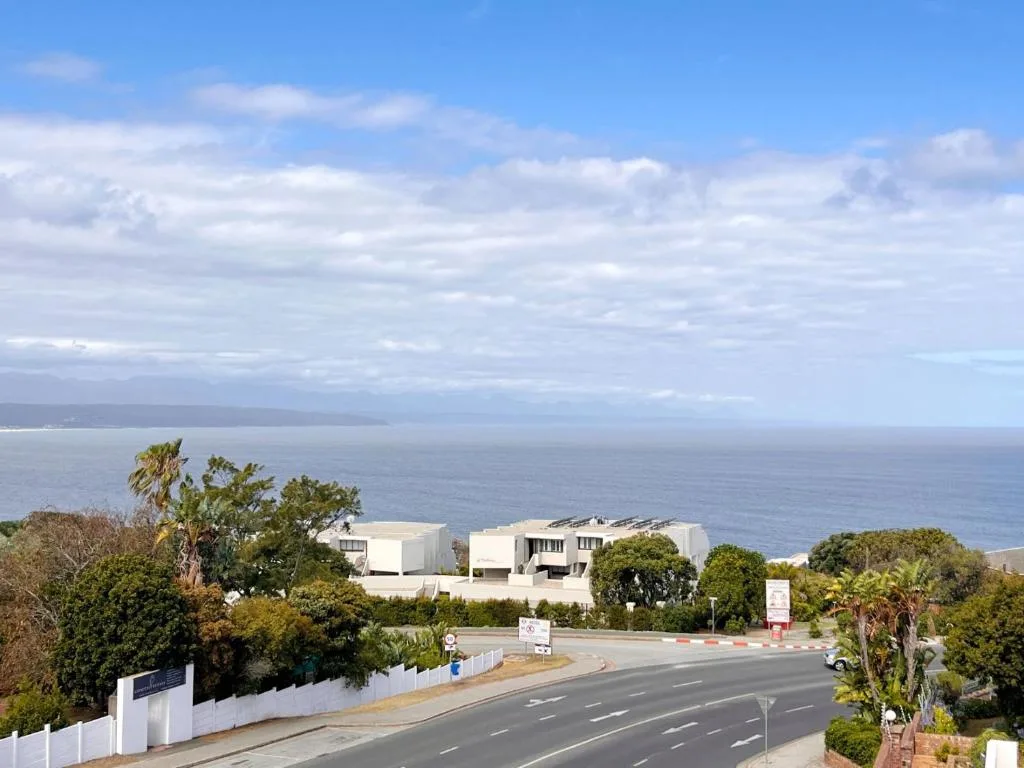 Ocean and mountain vista from elevated property overlooking Plettenberg Bay