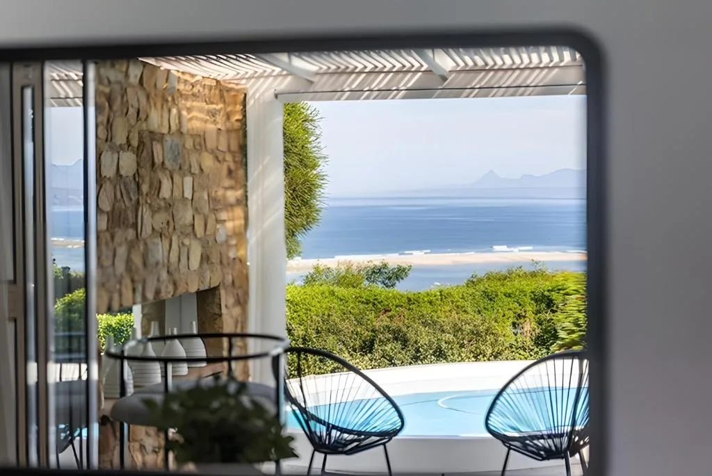 Ocean and lagoon vista from modern deck with contemporary seating