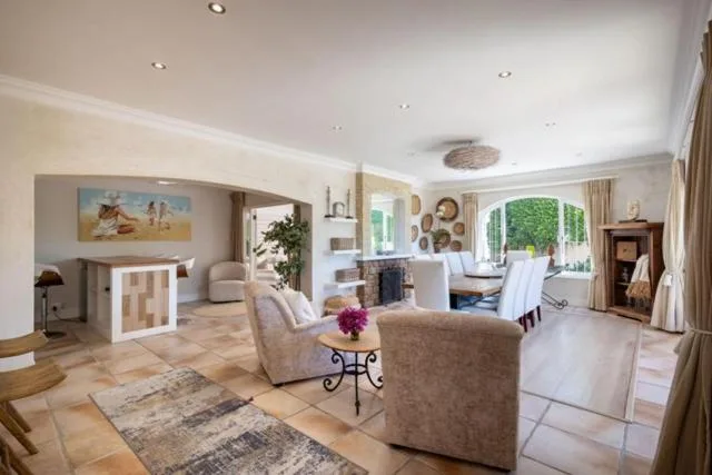 Spacious living room with comfortable seating and fireplace