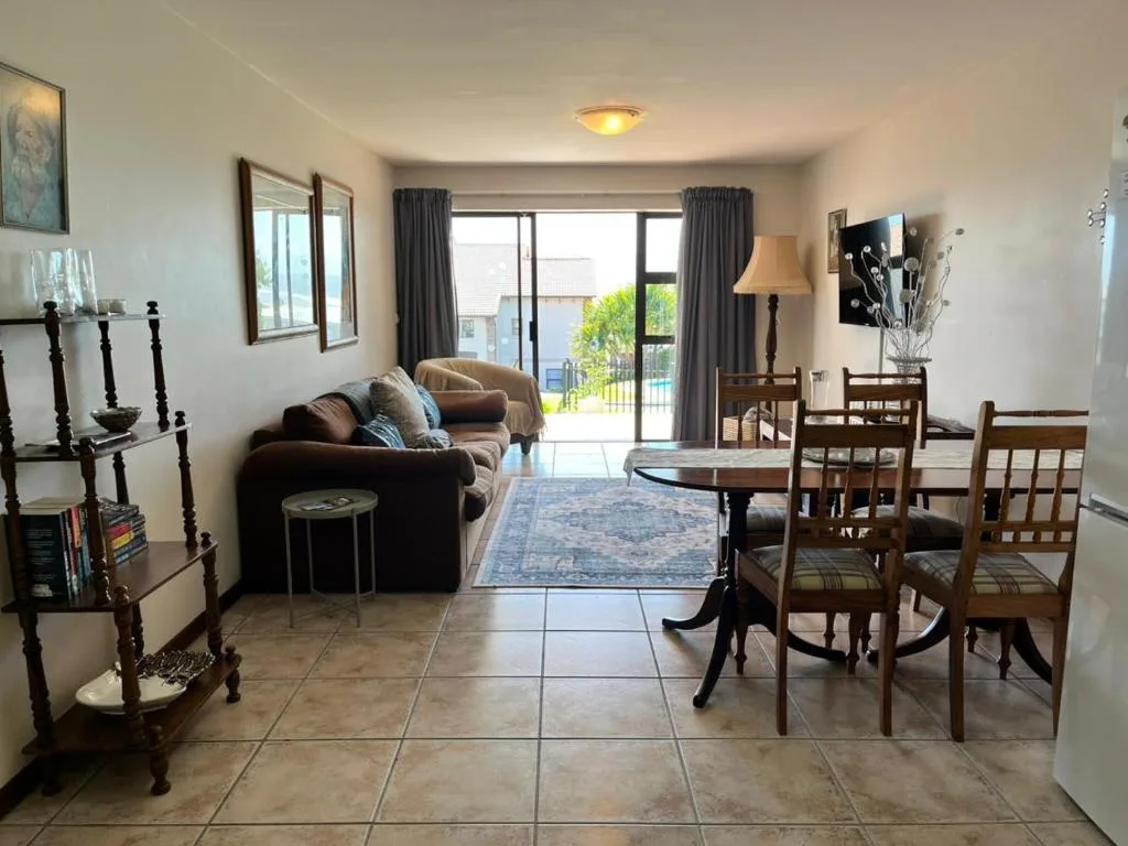 Open-plan lounge and dining area with comfortable seating and views