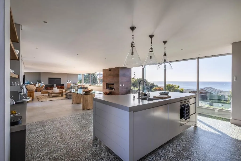 Modern kitchen island with sea views and open-plan living space