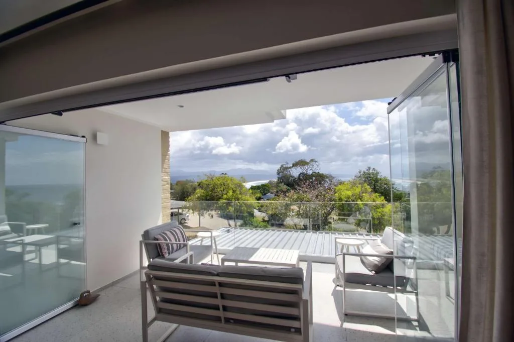 Modern deck with seating overlooking lagoon and mountain views, Plettenberg Bay