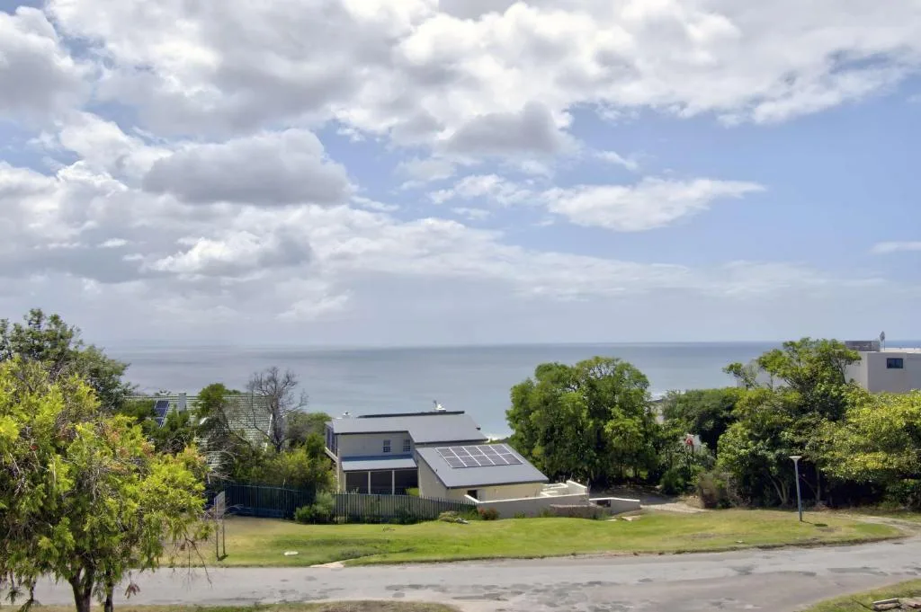 Scenic ocean view across Plettenberg Bay from property with houses below