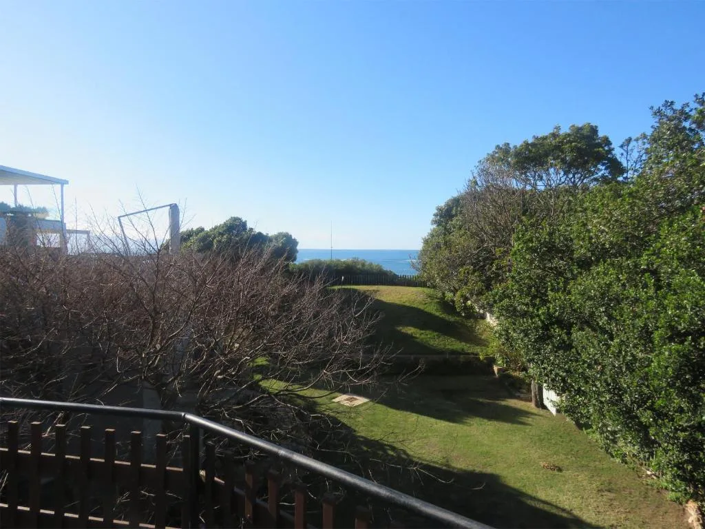 Ocean and coastal landscape visible from property garden area