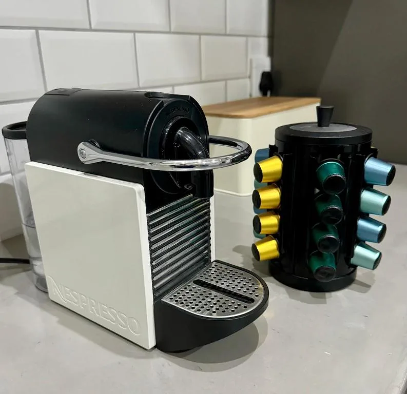Nespresso coffee machine with capsule holder on kitchen counter