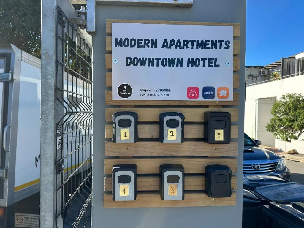 Signage for Modern Apartments Downtown Hotel with numbered mailboxes