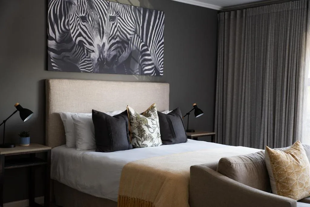 Modern bedroom with cream upholstered headboard and contemporary decor