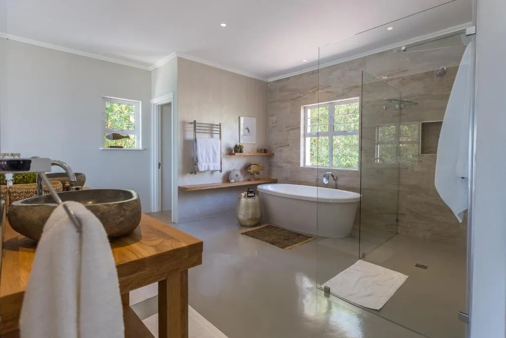 Luxurious modern bathroom with freestanding tub and walk-in shower enclosure
