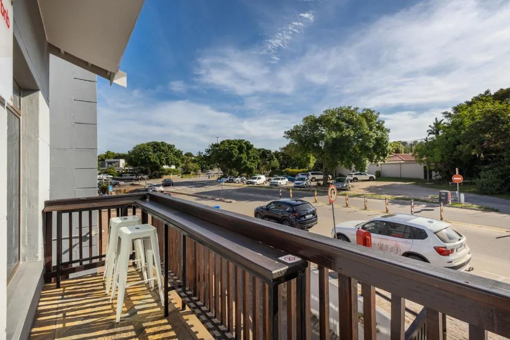 Wooden balcony with views over parking area and town surroundings