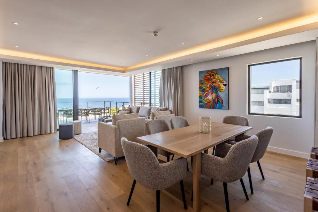 Open-plan living and dining area with ocean views and modern furnishings