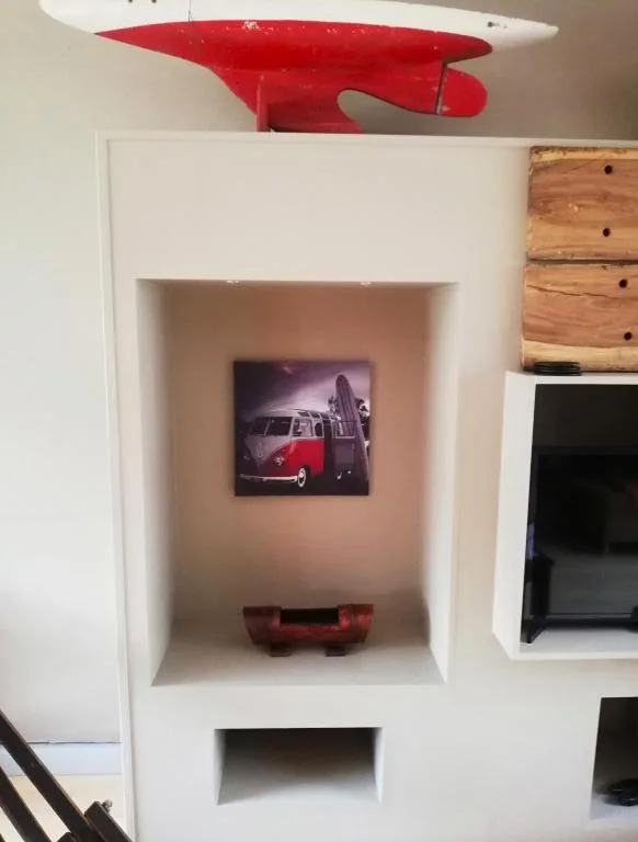 Decorative wall niche with vintage surfboard and retro van artwork