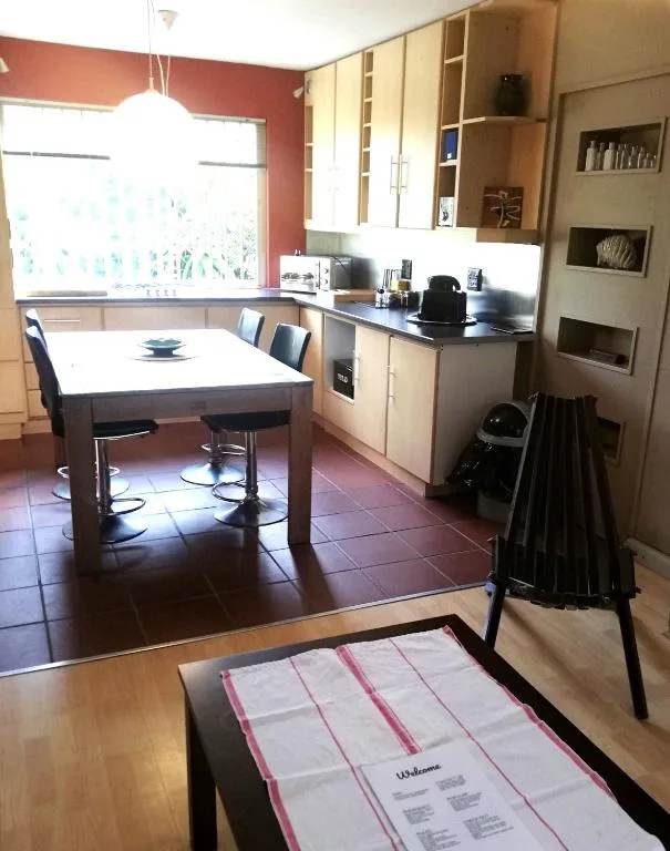 Dining table with chairs in open-plan kitchen and dining area