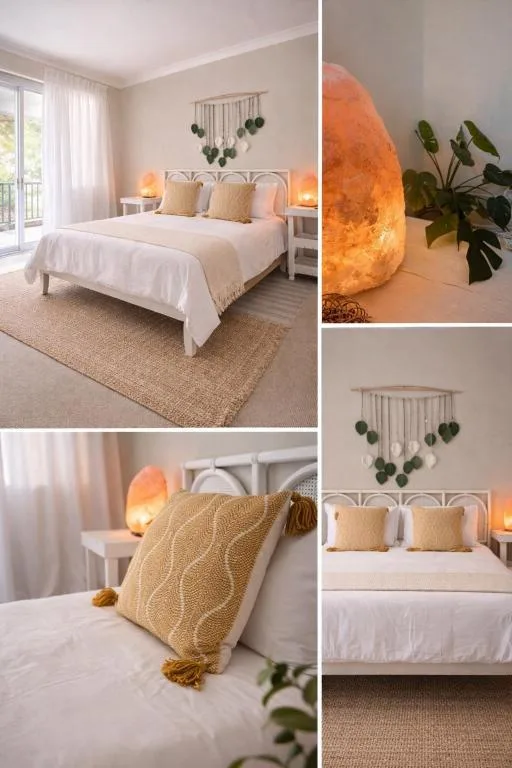 Serene bedroom with white bed, warm lighting, and boho decor accents