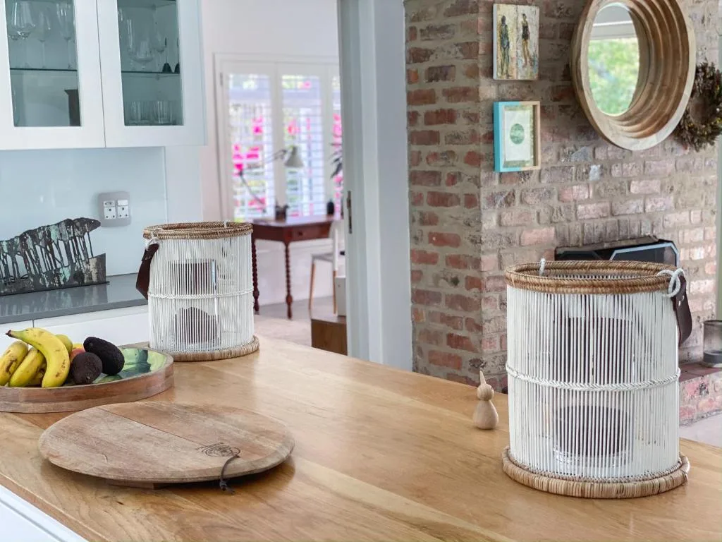 Rustic woven baskets and wooden accessories on kitchen counter