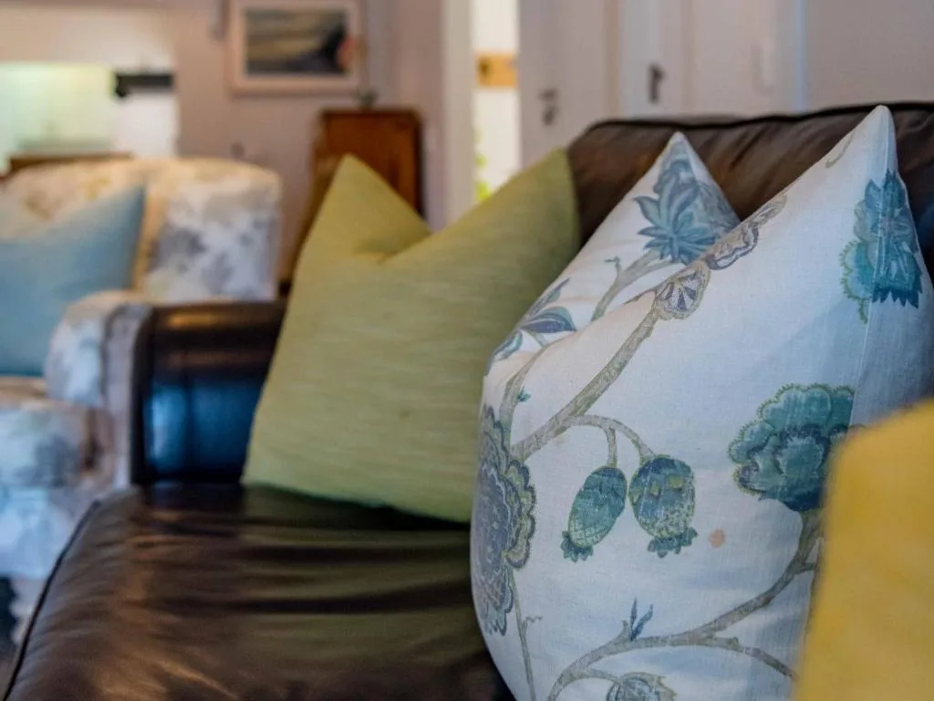 Comfortable lounge seating with decorative pillows and soft furnishings