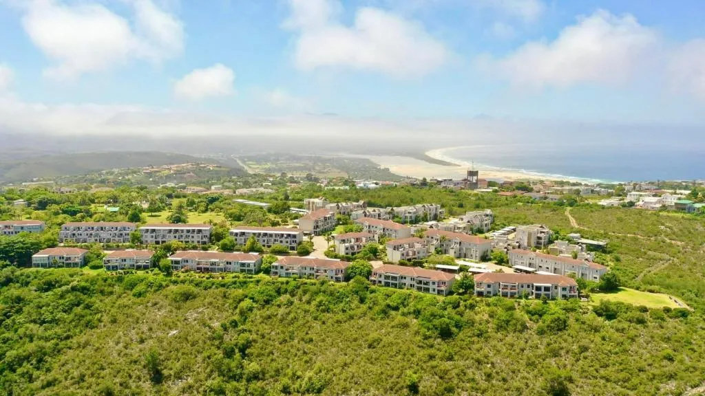 Aerial view of beachfront development overlooking Plettenberg Bay coastline